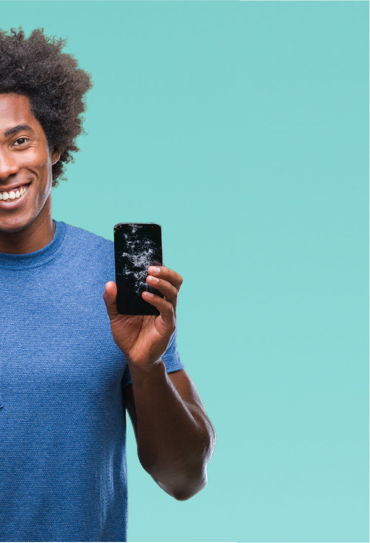 An african-american young male holding a phone with a cracked screen. Phone repair, tablet repair, console repair, computer repair in Hamilton.